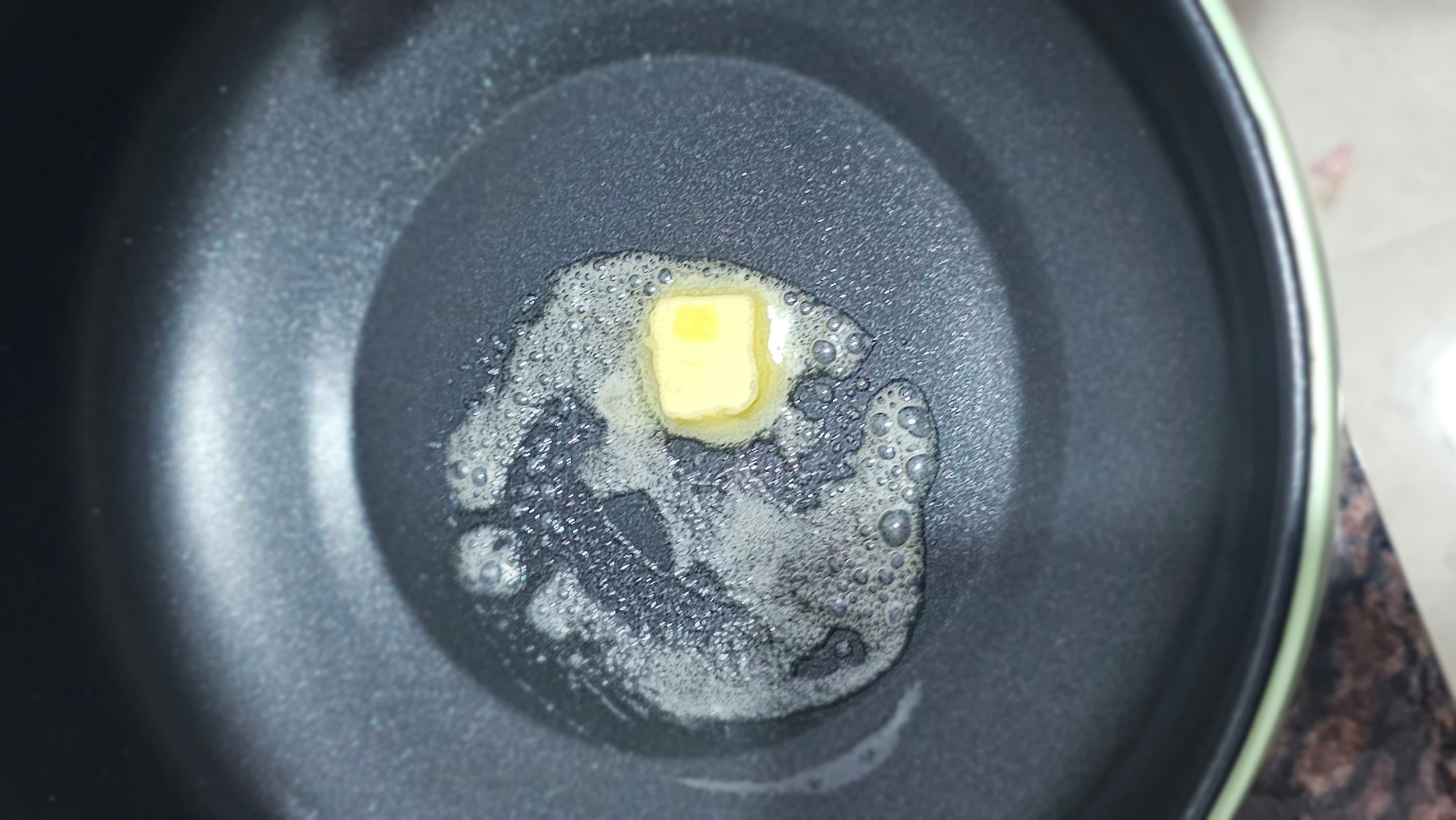 small center Omelette mixture in pan